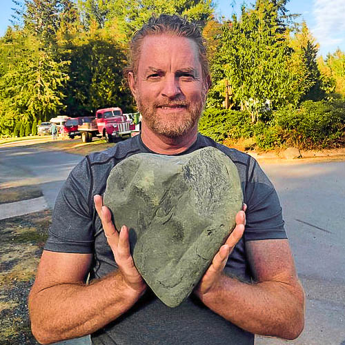 David holding a heart rock he found near Elwha RV Park and Campground in Port Angeles WA